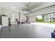 Spacious three-car garage with epoxy flooring, offering ample parking and storage space at 6375 Haystack Ct, Cumming, GA 30040