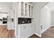 View of kitchen features glass doored hutch and subway tile backsplash at 6375 Haystack Ct, Cumming, GA 30040
