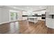Modern kitchen with white cabinets, stainless appliances, and a large center island at 6375 Haystack Ct, Cumming, GA 30040
