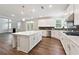 Gorgeous kitchen with white cabinetry, center island, and stainless steel appliances at 6375 Haystack Ct, Cumming, GA 30040