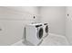 Laundry room featuring white cabinets and a new washer and dryer at 6375 Haystack Ct, Cumming, GA 30040