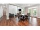 Inviting space featuring wood-look flooring, fireplace, and ample natural light from doors to the outside at 6375 Haystack Ct, Cumming, GA 30040
