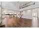 Open concept living room and kitchen boasts hardwood floors and plenty of natural light at 6375 Haystack Ct, Cumming, GA 30040