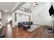 Comfortable living room with a lofted ceiling, wood-look floors, a cozy leather sofa and decorative accents at 6375 Haystack Ct, Cumming, GA 30040
