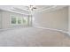 Large primary bedroom with tray ceiling and ample natural light at 6375 Haystack Ct, Cumming, GA 30040