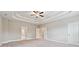 Spacious main bedroom featuring a tray ceiling and neutral decor at 6375 Haystack Ct, Cumming, GA 30040