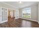 Office with hardwood floors, french doors, and a large window overlooking the front yard at 6375 Haystack Ct, Cumming, GA 30040