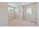 Bright walk-in closet with carpeted floors, and adjustable metal shelving at 6375 Haystack Ct, Cumming, GA 30040