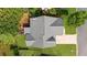 Aerial view showcasing the roofline, backyard, and surrounding landscape at 100 Inspiration Ln, Dallas, GA 30157