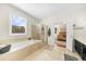 Bathroom includes a soaking tub, a glass-enclosed shower, and a garden view at 100 Inspiration Ln, Dallas, GA 30157