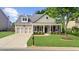 Charming home with manicured front yard, two-car garage, and inviting entrance at 100 Inspiration Ln, Dallas, GA 30157