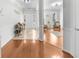Welcoming foyer with hardwood floors and an open view into the living room and home entrance at 100 Inspiration Ln, Dallas, GA 30157