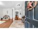 Inviting foyer with tile and hardwood floors, leading into the home's living spaces at 100 Inspiration Ln, Dallas, GA 30157