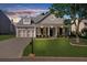 Charming single-Gathering home with a welcoming front porch, two-car garage, and manicured lawn with beautiful curb appeal at 100 Inspiration Ln, Dallas, GA 30157