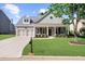 Charming single-Gathering home with a beautifully landscaped front yard and inviting front porch at 100 Inspiration Ln, Dallas, GA 30157