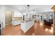 Open kitchen concept with island, granite countertops, stainless appliances, and eat in area at 100 Inspiration Ln, Dallas, GA 30157