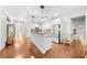 Modern kitchen with a large island, granite countertops, stainless steel appliances, and hardwood floors at 100 Inspiration Ln, Dallas, GA 30157