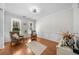 Well-lit living room with hardwood floors, wainscoting and neutral decor at 100 Inspiration Ln, Dallas, GA 30157