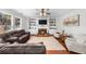 Cozy living room with fireplace, built-in shelving, and comfortable seating arrangements at 100 Inspiration Ln, Dallas, GA 30157