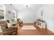 Well-lit living room with hardwood floors, wainscoting and neutral decor at 100 Inspiration Ln, Dallas, GA 30157