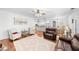 Spacious living room with hardwood floors, neutral paint, and ample seating at 100 Inspiration Ln, Dallas, GA 30157