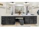 Large main bathroom vanity with double sinks and a large mirror with black cabinets at 100 Inspiration Ln, Dallas, GA 30157