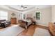 Spacious main bedroom with windows, neutral paint, and hardwood floors at 100 Inspiration Ln, Dallas, GA 30157