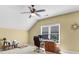 Cozy office space with natural light, desk, and ceiling fan at 100 Inspiration Ln, Dallas, GA 30157