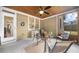 Relaxing screened porch with outdoor seating and ceiling fan at 100 Inspiration Ln, Dallas, GA 30157