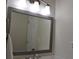 Bathroom mirror with modern lighting fixtures at 1676 Northridge Dr, Morrow, GA 30260