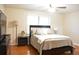Well-lit bedroom has a dark wood furniture set with a comfortable bed at 1676 Northridge Dr, Morrow, GA 30260