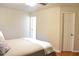 Bedroom with neutral tones, comfortable bedding, and hardwood floors at 1676 Northridge Dr, Morrow, GA 30260