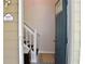 Front door of house number 1676 with a view of the interior staircase and decor at 1676 Northridge Dr, Morrow, GA 30260