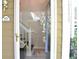 Front door viewed through screen door with house number plaque and view of staircase inside at 1676 Northridge Dr, Morrow, GA 30260