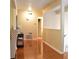 Entryway with hardwood floors, light-colored walls, and view into hallway bathroom and upstairs staircase at 1676 Northridge Dr, Morrow, GA 30260