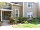 Charming exterior of a two-story house featuring well-maintained lawn and flower bed at 1676 Northridge Dr, Morrow, GA 30260