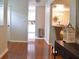 Hallway leading to dining room with hardwood floors and modern décor at 1676 Northridge Dr, Morrow, GA 30260