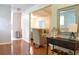 Open hallway with hardwood floors that leads to the living room area at 1676 Northridge Dr, Morrow, GA 30260