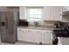 Modern kitchen with stainless steel appliances, granite countertops, and ample counter space at 1676 Northridge Dr, Morrow, GA 30260