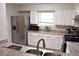 Updated kitchen featuring stainless steel appliances, granite countertops, and white cabinets at 1676 Northridge Dr, Morrow, GA 30260