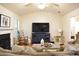 Cozy living room with fireplace, rocking chair, and large-screen television at 1676 Northridge Dr, Morrow, GA 30260