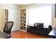 Bright office featuring bookshelves, storage cabinet, and a comfortable chair at 1676 Northridge Dr, Morrow, GA 30260