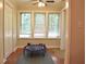Well-lit sun room with multiple windows, and area for exercise at 1676 Northridge Dr, Morrow, GA 30260