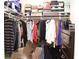 Organized walk-in closet with shelving and clothing racks and shoe boxes at 1676 Northridge Dr, Morrow, GA 30260