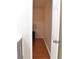 Walk-in closet with hardwood floors, perfect for organized storage at 1676 Northridge Dr, Morrow, GA 30260