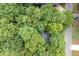 An aerial view displays a densely wooded lot at 1922 Knipe Sw Dr, Marietta, GA 30064