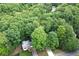 Aerial view of a home situated in a lush, wooded neighborhood at 1922 Knipe Sw Dr, Marietta, GA 30064