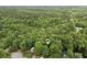 An aerial view captures a home with wooded surroundings at 1922 Knipe Sw Dr, Marietta, GA 30064