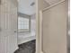 Bathroom with a shower and tub featuring black marble flooring and window at 1922 Knipe Sw Dr, Marietta, GA 30064