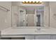 Bathroom vanity with a framed mirror and modern lighting fixtures at 1922 Knipe Sw Dr, Marietta, GA 30064